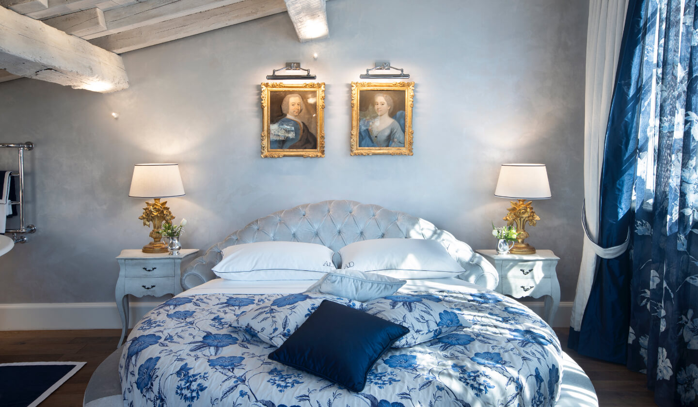 Detail of the round bed and fine blue linen, Suite La Principessa, Antica Dimora Desenzano